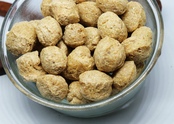 istock Heap of soya chunks isolated on white background 1248422601
