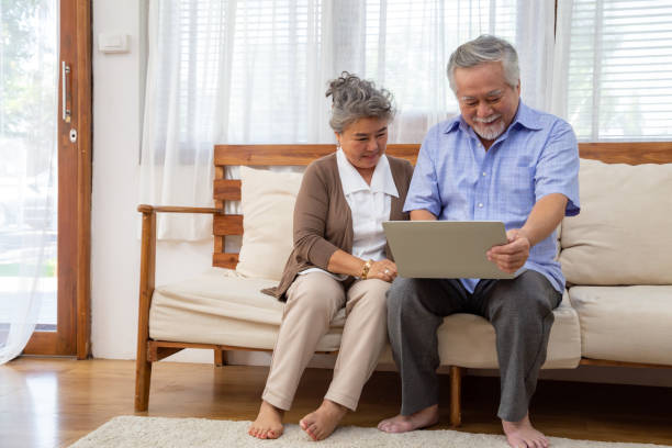 istock Asian senior couple talking in video call chat on laptop computer, Smart technology for old age and online activism staying connected concept 1248433136