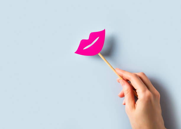istock World kissing day concept with lips on stick on blue background 1248433280