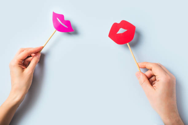 istock World kissing day concept with lips on stick on blue background 1248433293