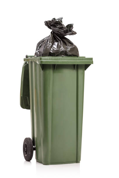 istock Studio shot of a green waste bin with a plastic bag inside 1248433886