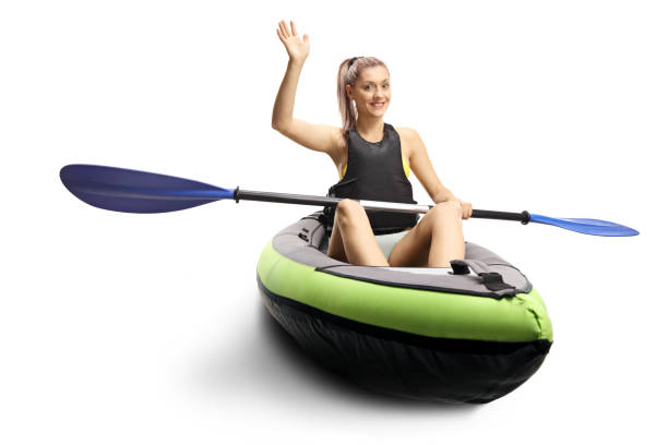 istock Woman kayaking and waving at the camera 1248434398