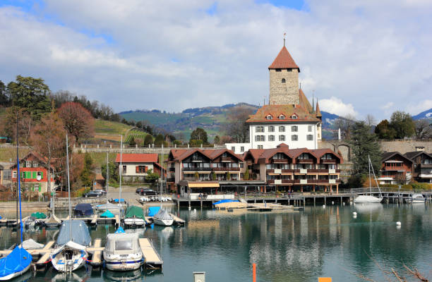 Spiez harbour, Spiez Castle and Lake Thun. Switzerland, Europe. Spiez, Switzerland - March 07, 2020: Visiting Spiez town on a sunny morning in March. Spiez is located on the southern shore of Lake Thun. thun interlaken winter switzerland stock pictures, royalty-free photos & images