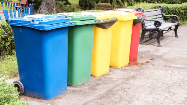 istock Separate containers for garbage collection in the park. Multi-colored street trash cans on the street. Containers Selective collection of waste. Environmental pollution concept 1248439687