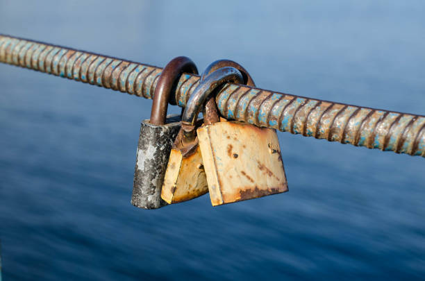istock Old padlock. A padlock hangs on the railing. Rusty metal. 1248441183