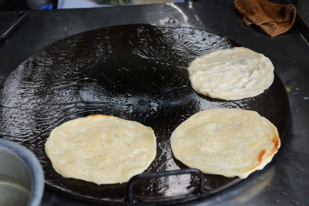 istock Soft focus of Fried Roti on a hot frying pan 1248443835