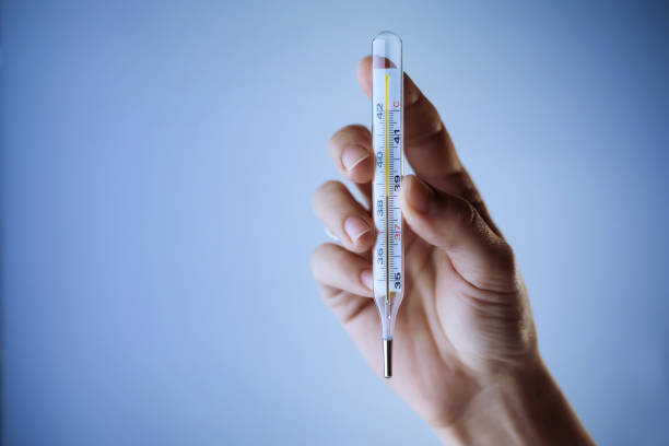 istock Thermometer in a woman\'s hand 1248445273