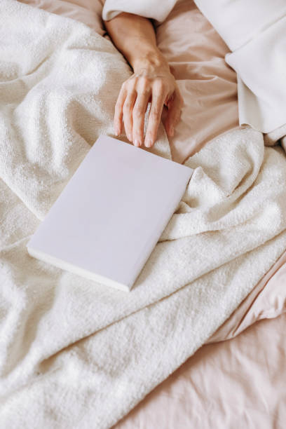 istock girl reading book bed morning weekend alone 1248447682