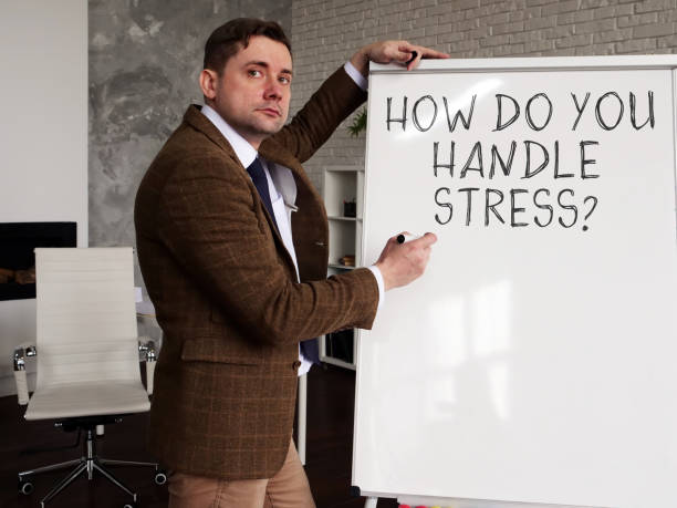 istock Mentor writes on the whiteboard How Do You Handle Stress? 1248447776