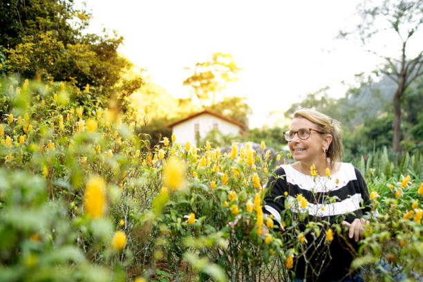 istock Woman outdoors enjoying her garden and relaxing 1248448795