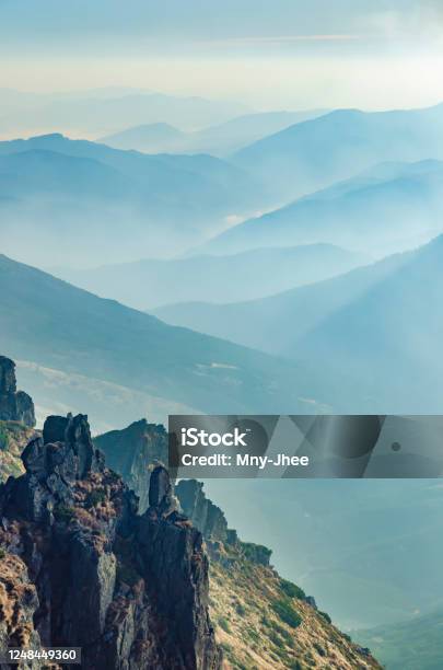 Sharp Rocks Illuminated By Morning Sun With Misty Mountainn Valleys In The Background Carpathian Mountains Ukraine Stock Photo - Download Image Now