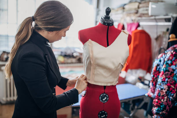 istock One young female fashion designer working hard in her workshop 1248452471