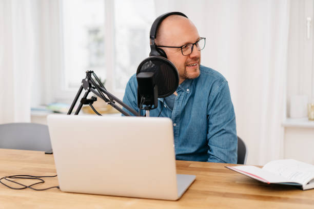 istock Middle-aged man working on recording a podcast 1248454313