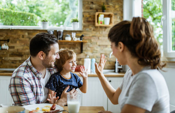 istock Happy family having fun during breakfast in dining room. 1248454453