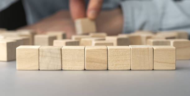 istock A pile of empty wood block on table. Business concept for growth success process. Copy space. 1248457204