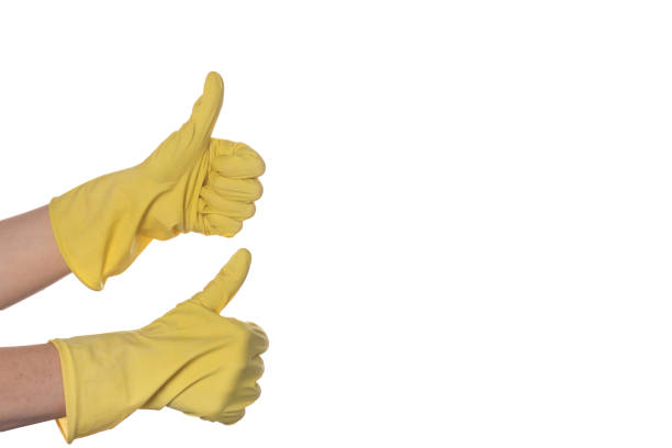 istock two hands in a yellow glove holding a thumb like a sign 1248460729