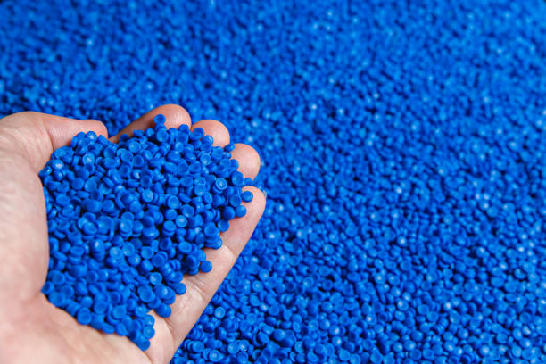 istock Blue plastic grain, plastic polymer granules,hand hold Polymer pellets, Raw materials for making water pipes, Plastics from petrochemicals and compound extrusion, resin from plant polyethylene. 1248463977