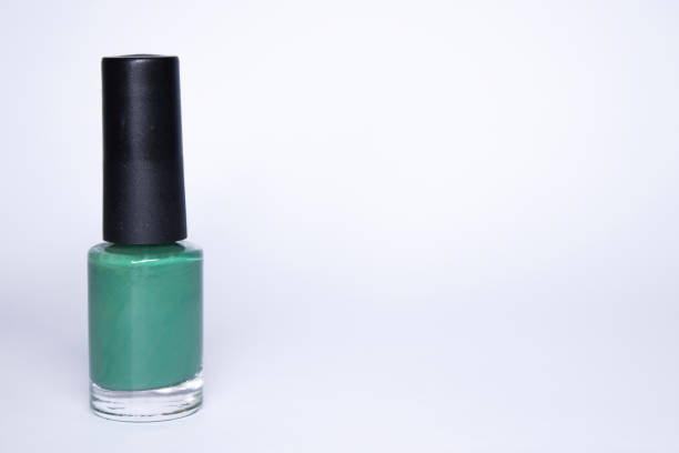 istock A bottle with blue nail polish on white background. nail lacquer. Nail manicure concept. Isolated, copy space 1248464063