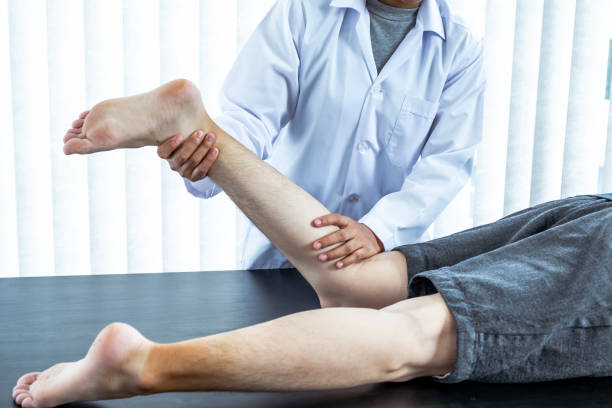 istock Physical therapy is doing leg therapy for patients in the hospital 1248467921