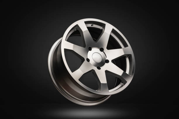 istock New polished silver alloy wheel on dark gradient background. modern design 1248469078