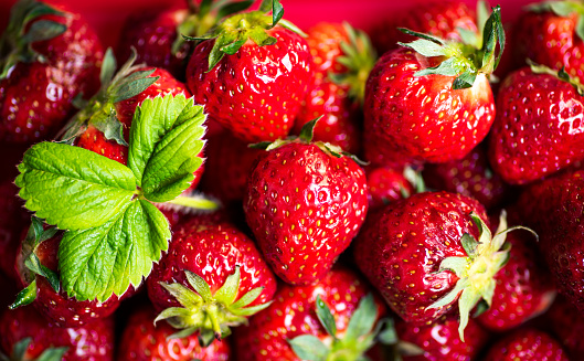 Strawberry fruit on a pile closeup pattern macro shot pattern