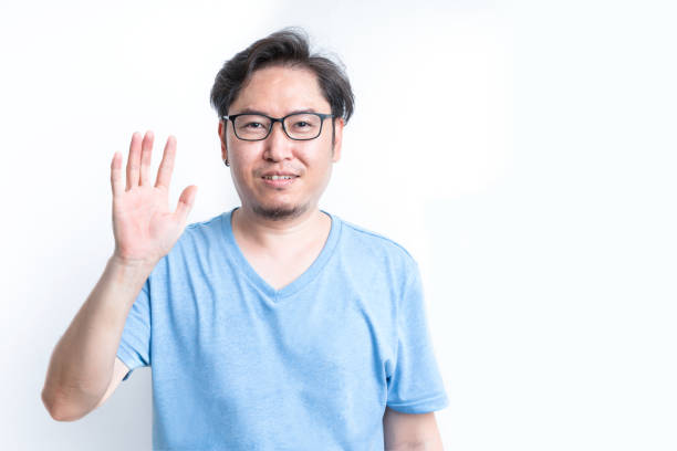 istock Portrait a man shows his hand for greeting 1248480726