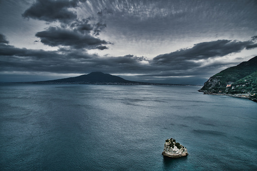 Looking over the Bay of Naples towards Mount Vesuvius in the background. The eruption of Mount Vesuvius in AD 79 destroyed the Roman cities of Pompeii, Herculaneum as well as several other settlements. Until today the Vulcano ist still active.