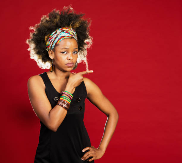Studio shot of a young woman wearing a jumpsuithttp://195.154.178.81/DATA/istock_collage/0/shoots/782690.jpg