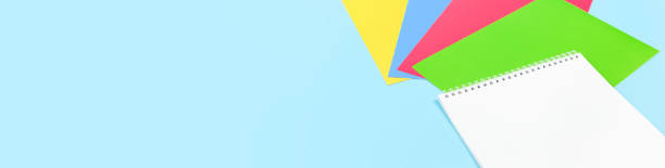 istock Color paper, paint and school stationery on blue 1248488113