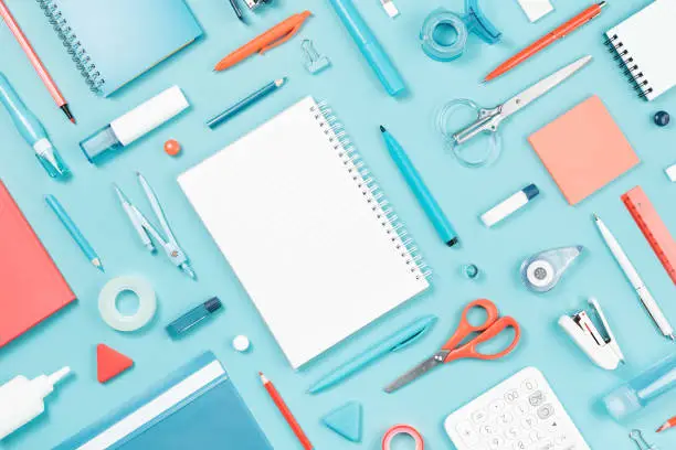 Photo of Assorted office and school white blue and orange stationery