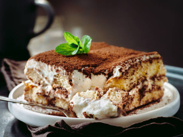 tiramisu cake with mint - dessert imagens e fotografias de stock