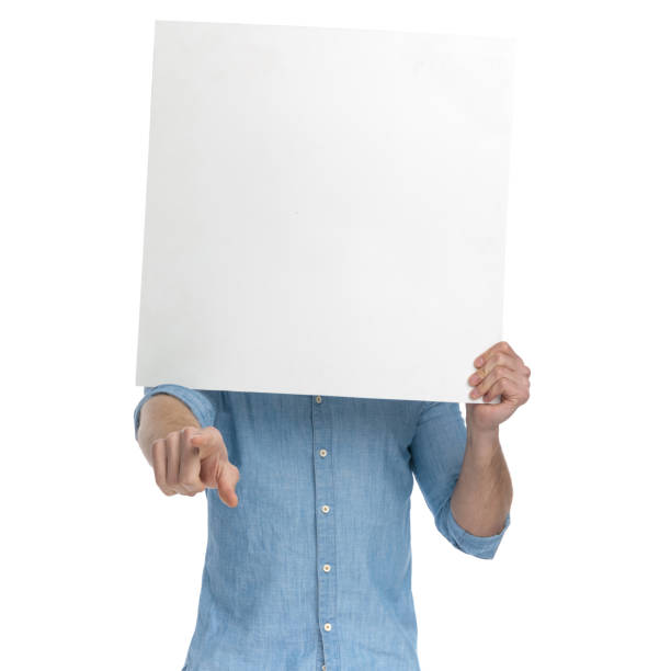 istock young casual man covering face with empty board 1248491031