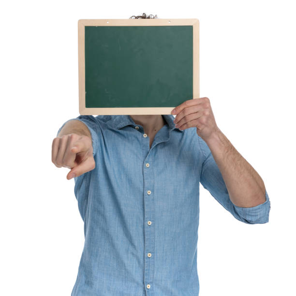 istock young casual man covering face with blackboard 1248491591