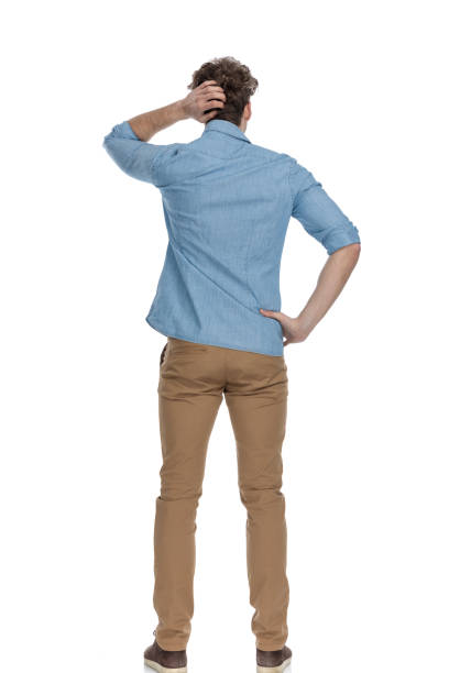 back view of casual man scratching head and thinking back view of casual man scratching head and thinking of ways to solve difficult problems, standing isolated on white background, full body itching on a photograph pictures stock pictures, royalty-free photos & images