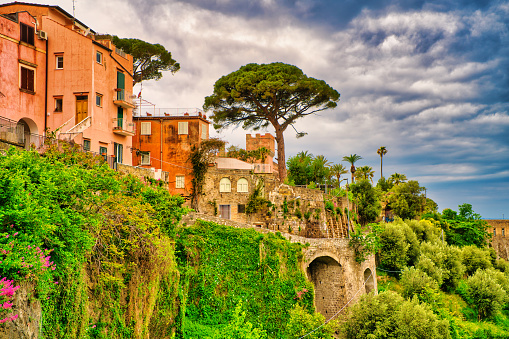 Looking at houses along the cliffside of the small village of Vico Equense.