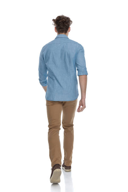 istock back view of casual guy in denim shirt walking 1248493080