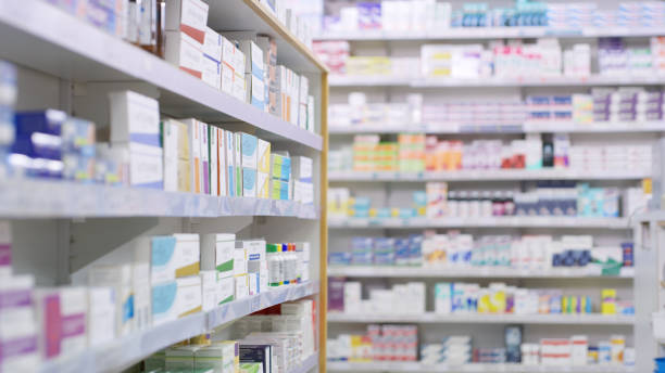 Nothing but the best brands for their customers Shot of shelves stocked with various medicinal products in a pharmacy medical supplies photos stock pictures, royalty-free photos & images