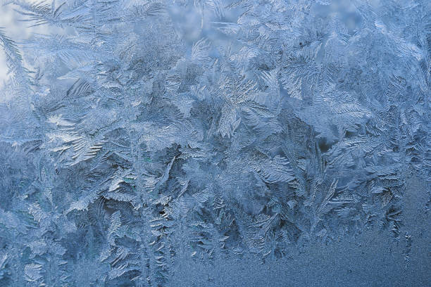 istock winter pattern of ice crystals on glass 1248503041