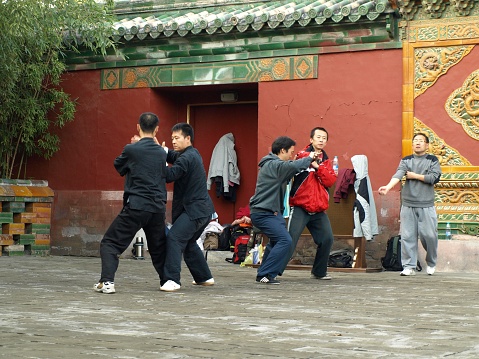 Beijing, China - October 30, 2010: People practicing Taijichuan in Beihai park on a weekend.