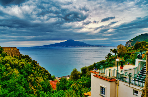 Looking from the small village of Vico Equense towards Mount Vesuvius over the Bay of Naples. The eruption of Mount Vesuvius in AD 79 destroyed the Roman cities of Pompeii, Herculaneum as well as several other settlements. until today the Vulcano ist still active.
