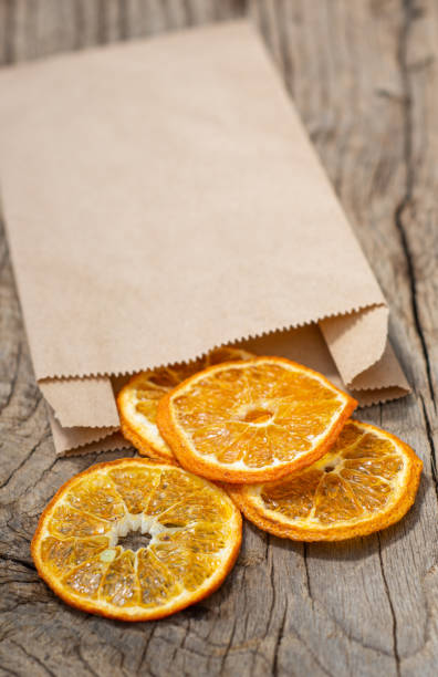 istock Slices of dried tangerines in craft package 1248504683