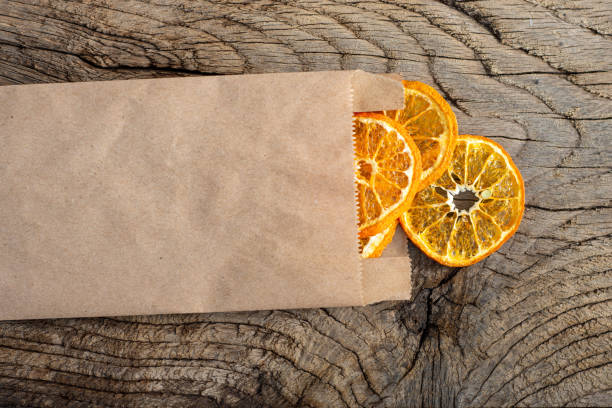istock Slices of dried tangerines in craft package 1248504761