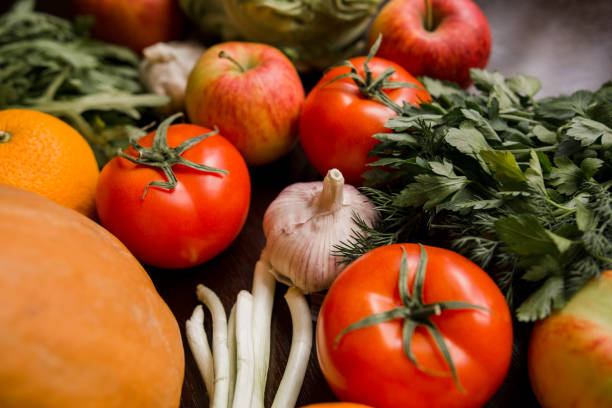 istock garlic tomato greens and vegetables on table 1248506779