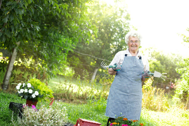 istock Happy elderly female gardener 1248508772