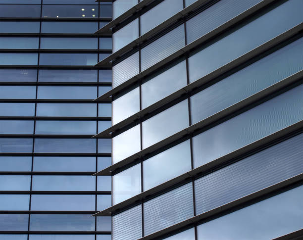 istock full frame modern office architecture abstract with geometric shapes of tall buildings reflecting the blue sky in large glass windows 1248508975