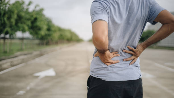 istock Sport man feeling backache outdoors 1248514358