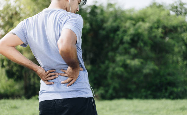 istock Sport man feeling backache outdoors 1248514397