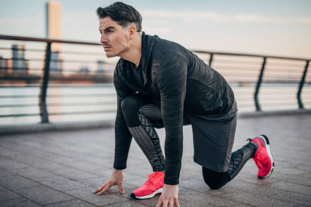 istock One young man at starting position ready to start running 1248520813