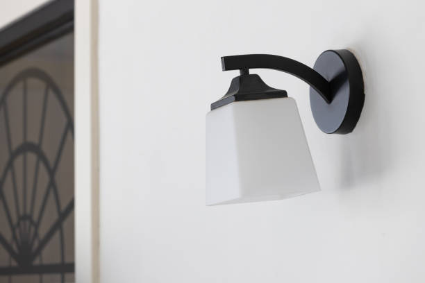 istock classic glass wall lamp on white concrete wall. 1248521377