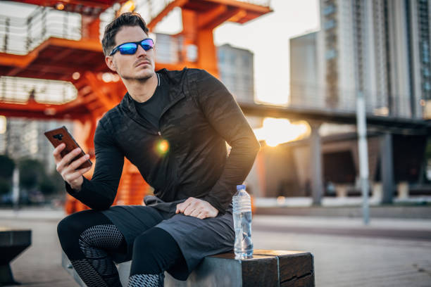 istock One handsome young man taking a break after running outdoors 1248521449
